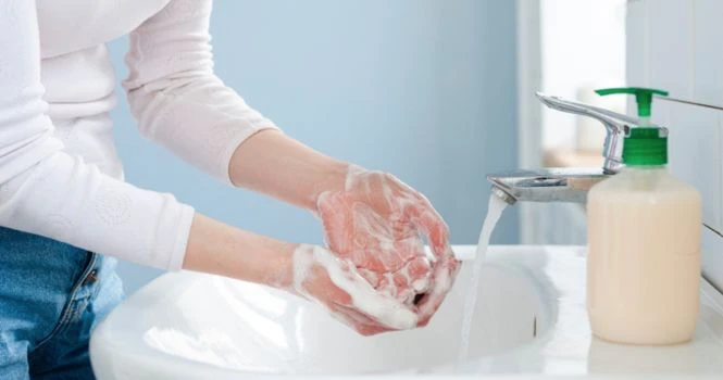 washing hands with soap and water